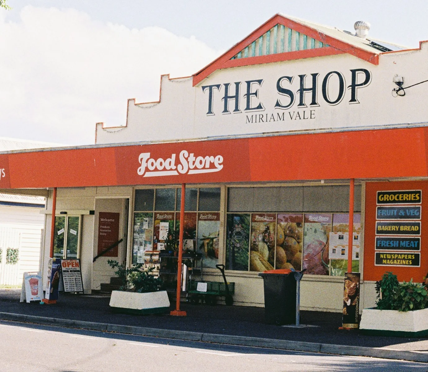 Country Queensland shopfront with a long run of street-facing glass